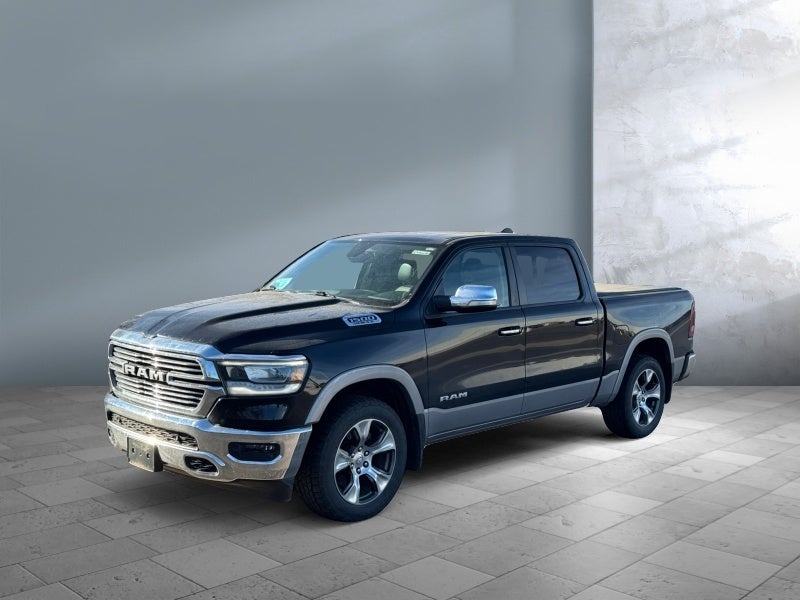 2019 RAM 1500 Laramie in Diamond Black Crystal Pearlcoat — front three-quarter view